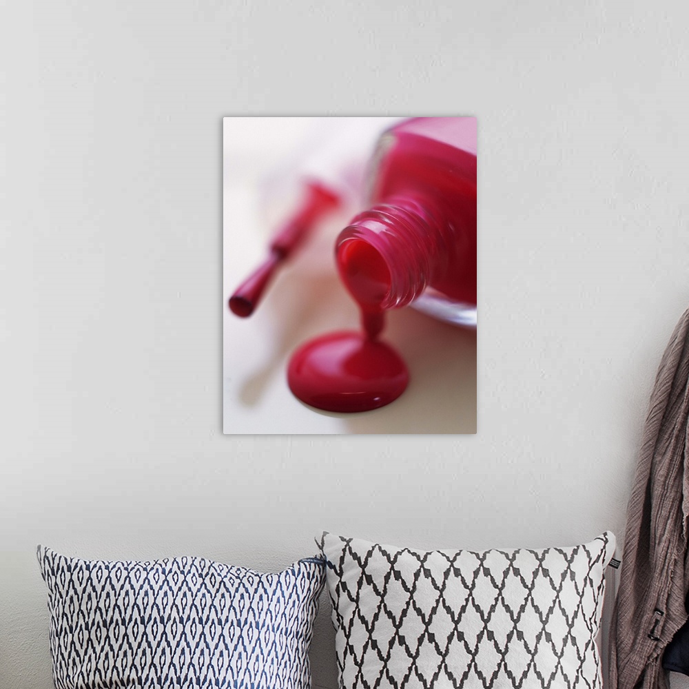 A bohemian room featuring Closed Up Image of Red-Colored Manicure Bottle, Differential Focus