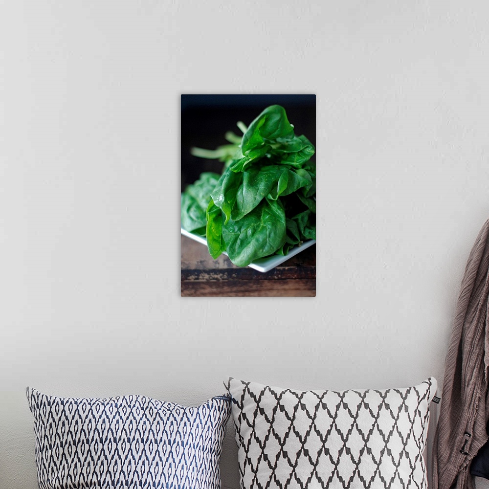 A bohemian room featuring Closeup of spinach on rustic table.