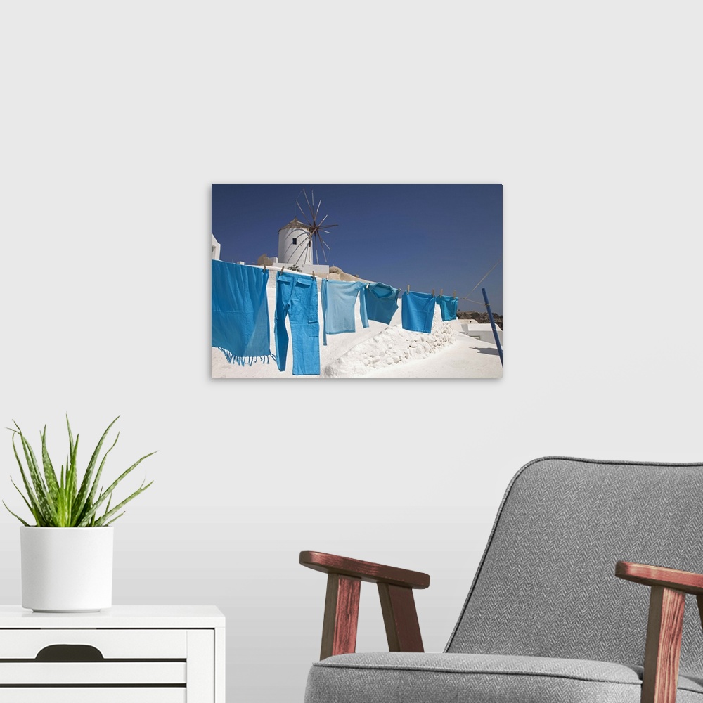 A modern room featuring Greece, Santorini, Oia, clothes drying, windmill in background