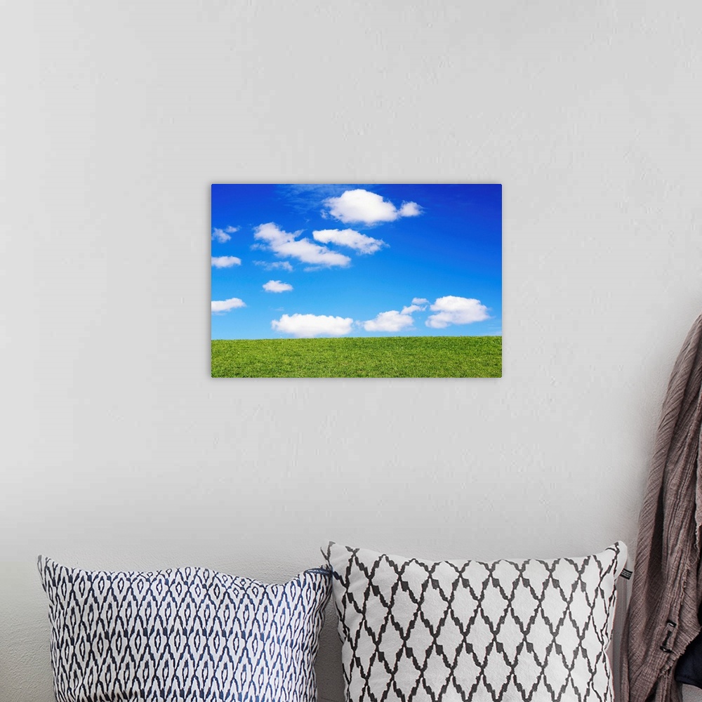 A bohemian room featuring Clouds In Blue Sky Over Green Grass