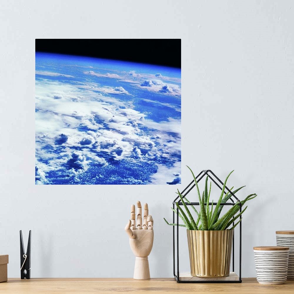 A bohemian room featuring Clouds over earth viewed from a satellite