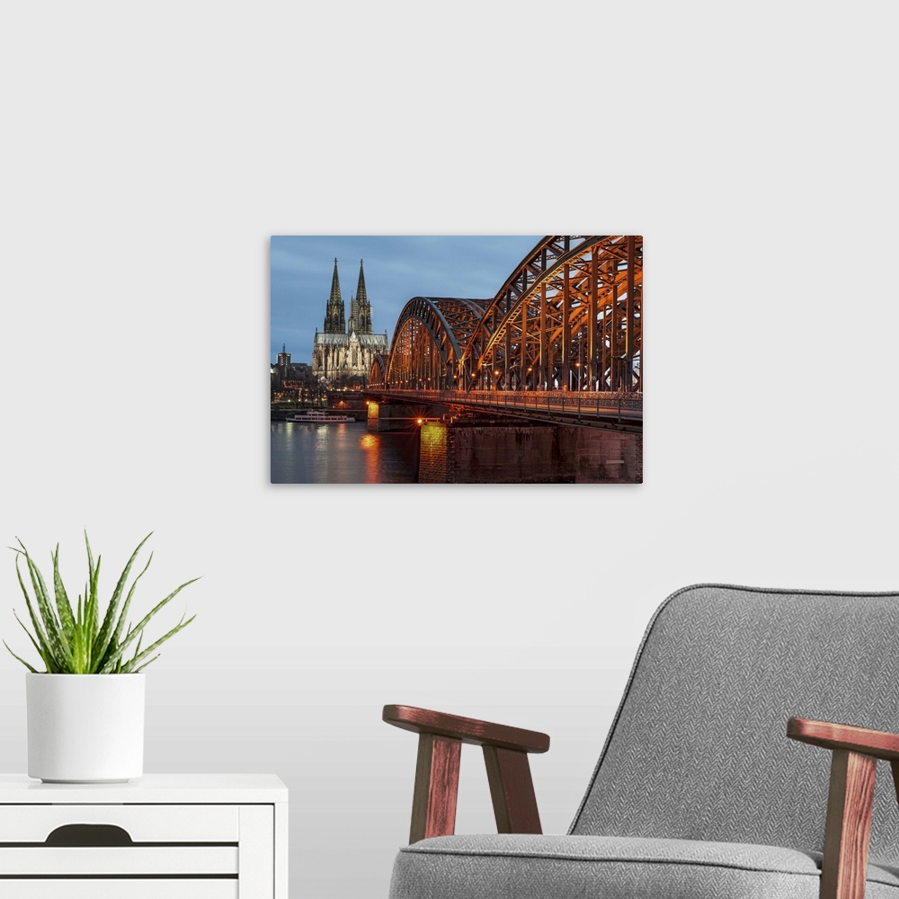 A modern room featuring Cologne cathedral at dusk in Germany.