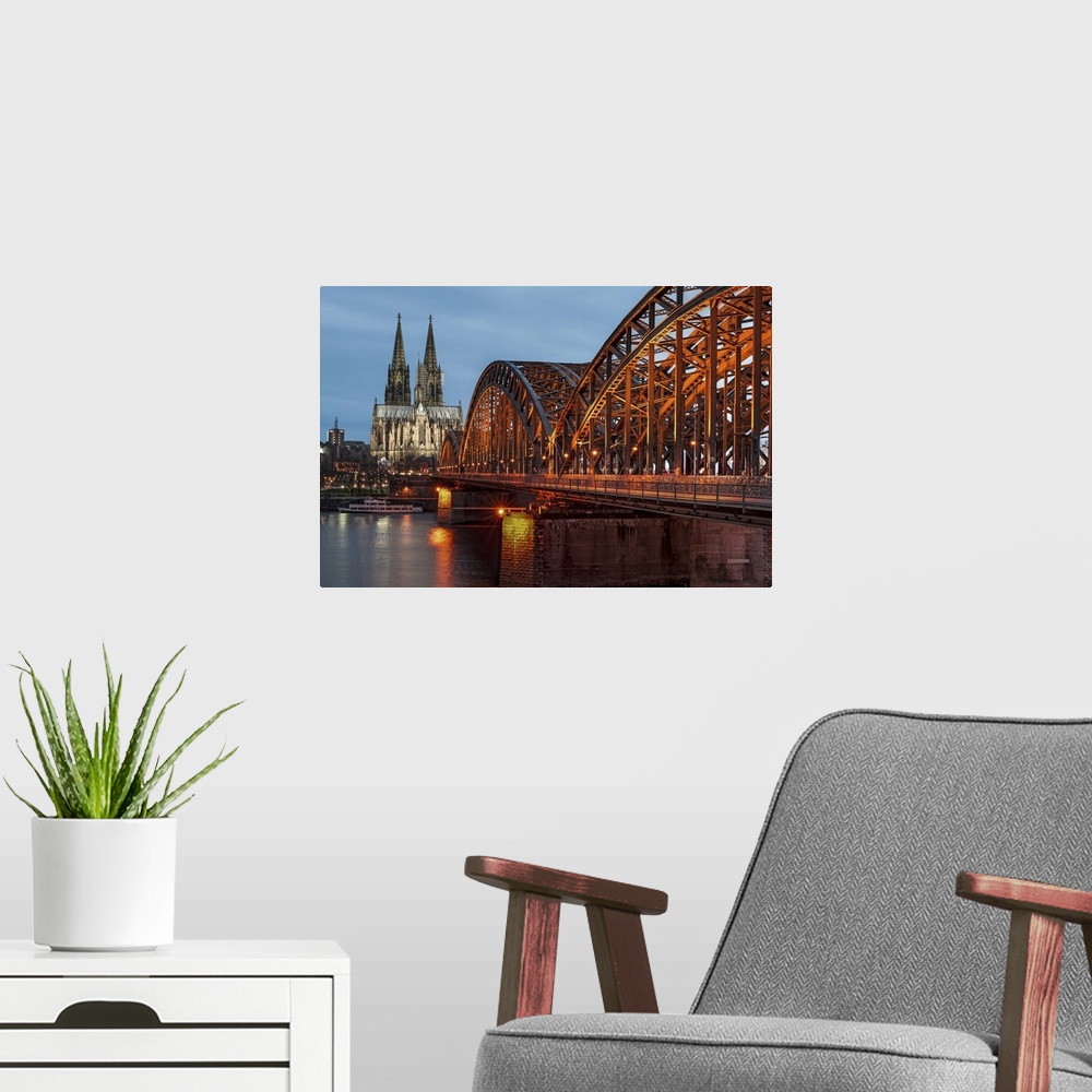 A modern room featuring Cologne cathedral at dusk in Germany.
