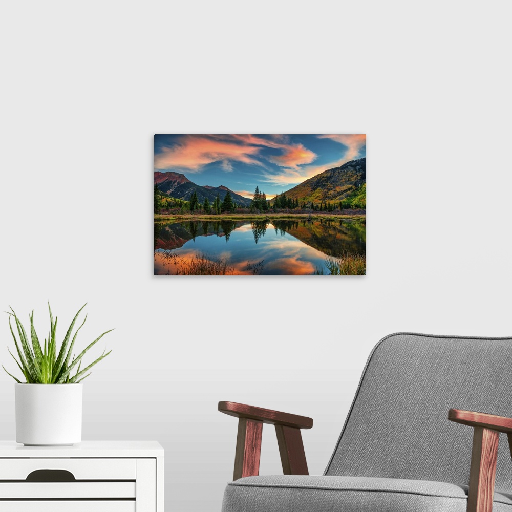 A modern room featuring Panoramic mountain view at sunrise in autumn.