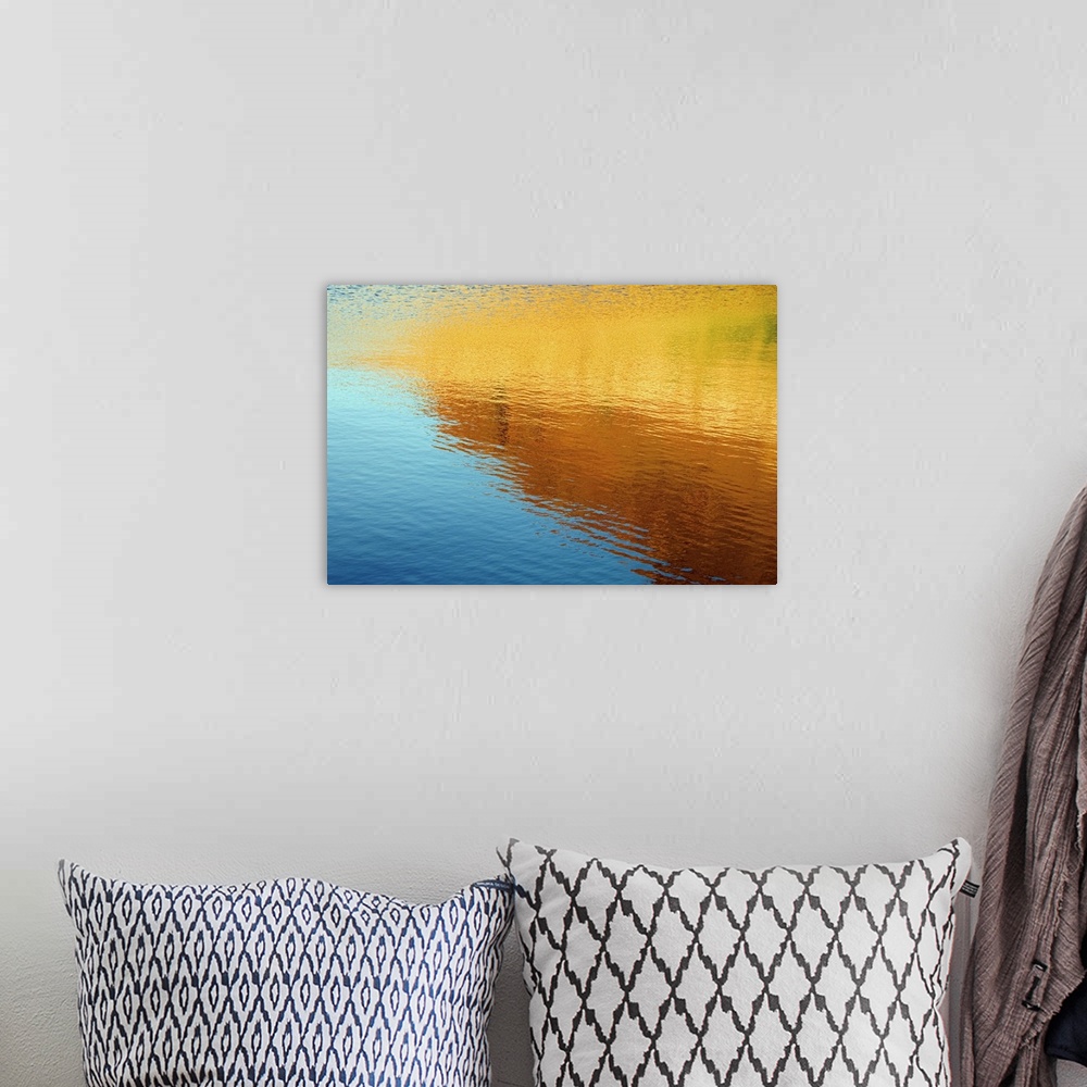 A bohemian room featuring Colorful photograph of ripples in water.