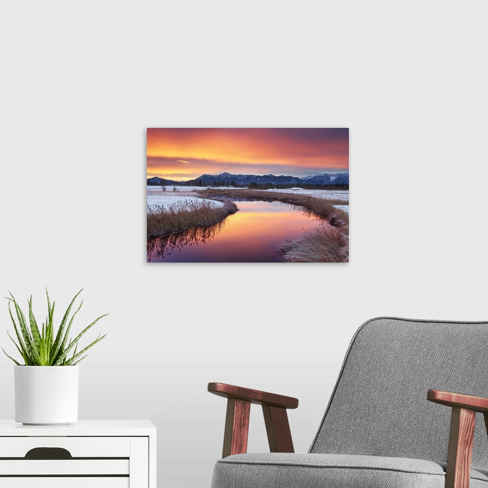 A modern room featuring Colorful sunrise with the Alps in background.