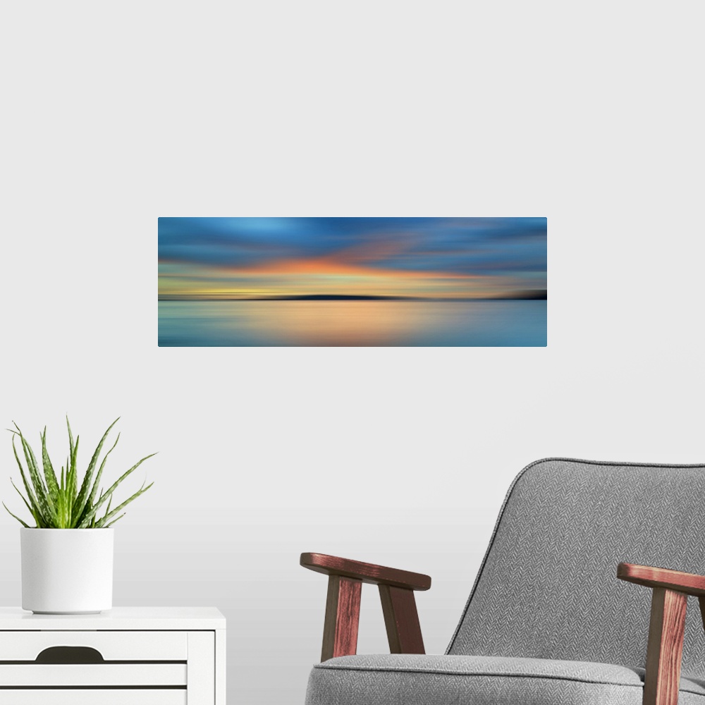 A modern room featuring Motion blurred colorful sunset with long exposure effect.