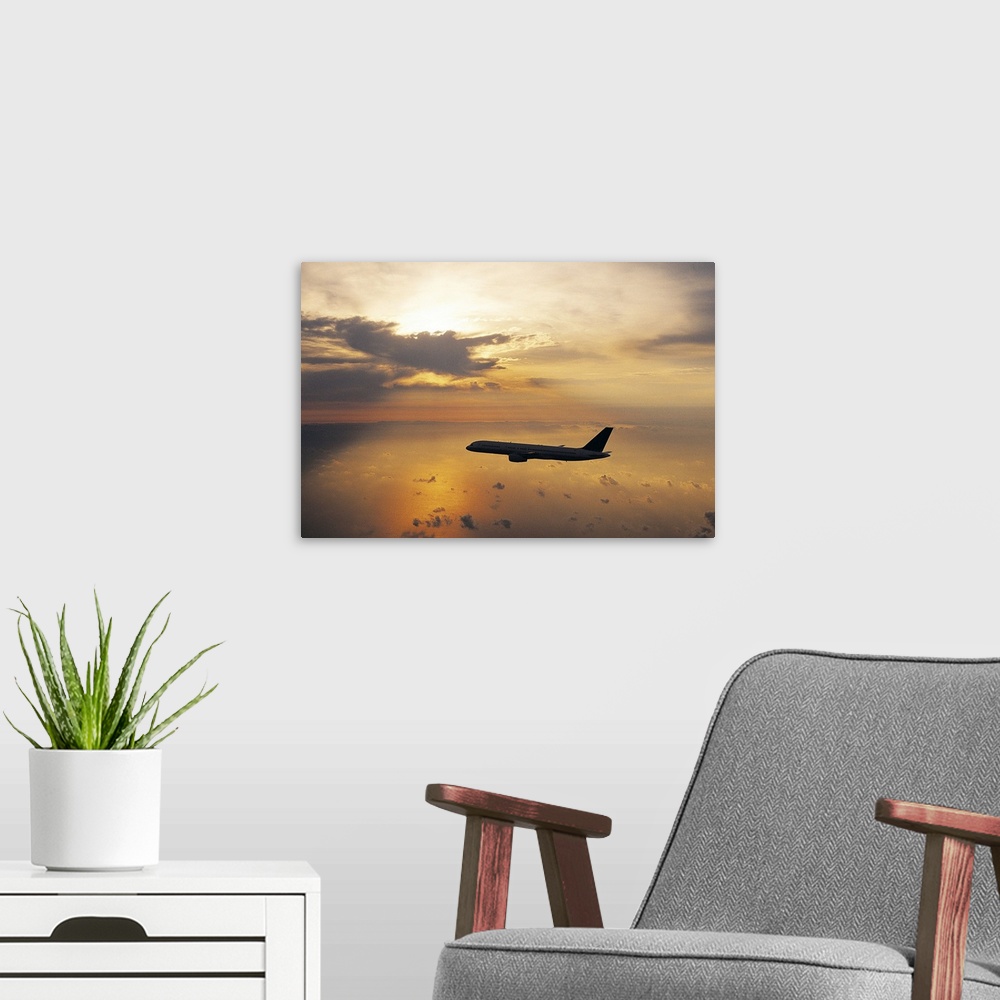 A modern room featuring Commercial Aeroplane Flying Above the Sea at Dusk