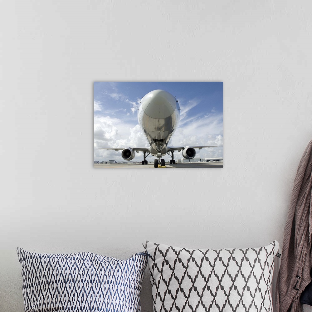 A bohemian room featuring Front End Section of Commercial Jet on Tarmac