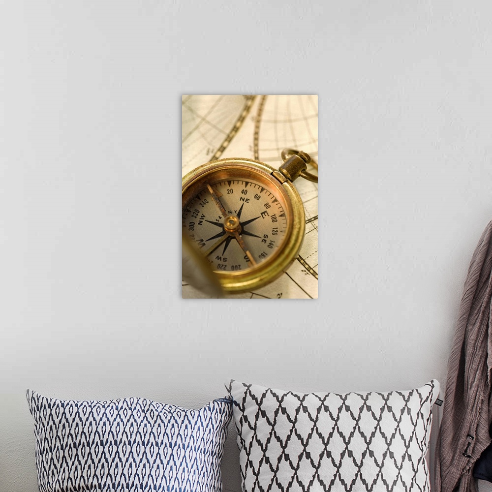 A bohemian room featuring Compass on antique map