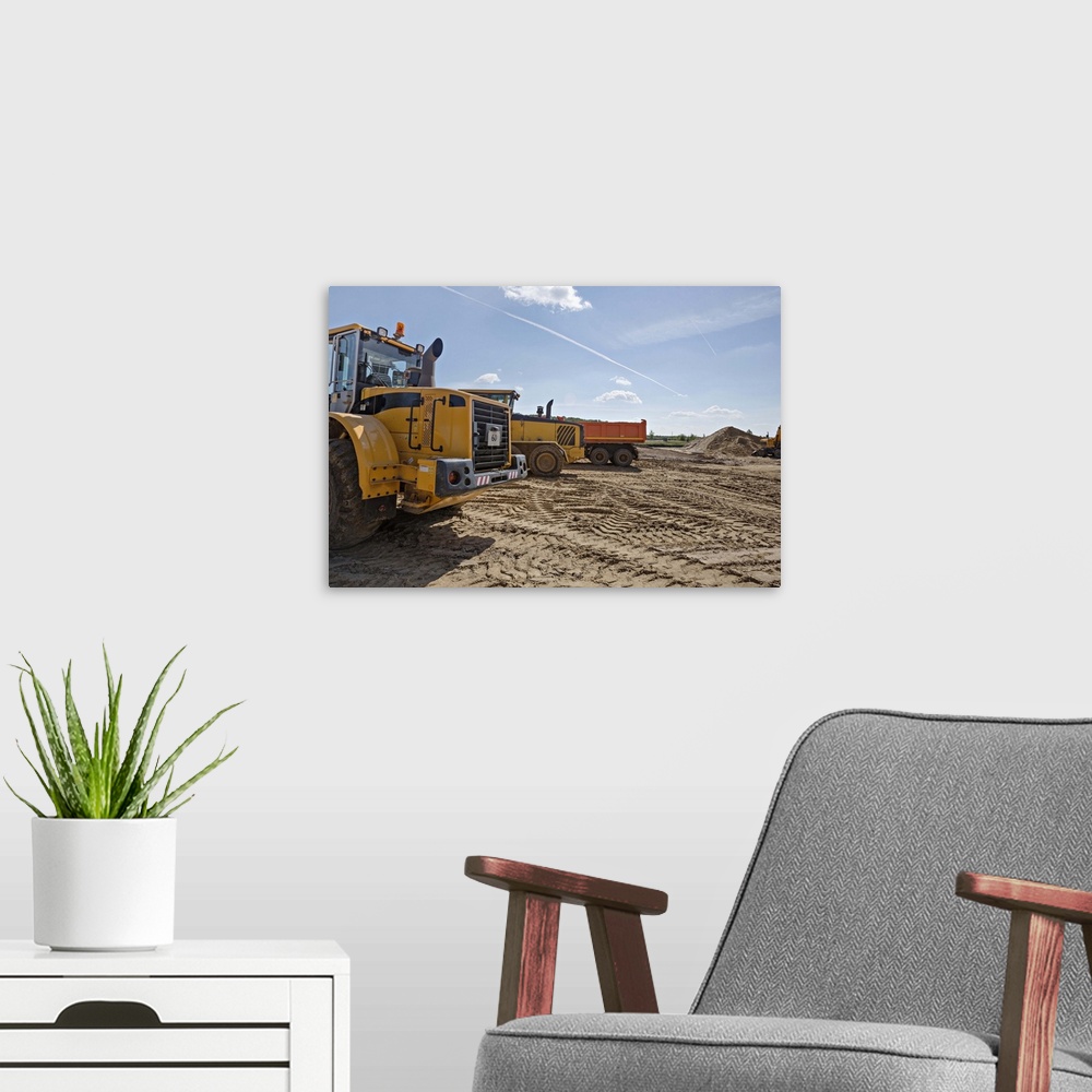 A modern room featuring Construction vehicles on work site