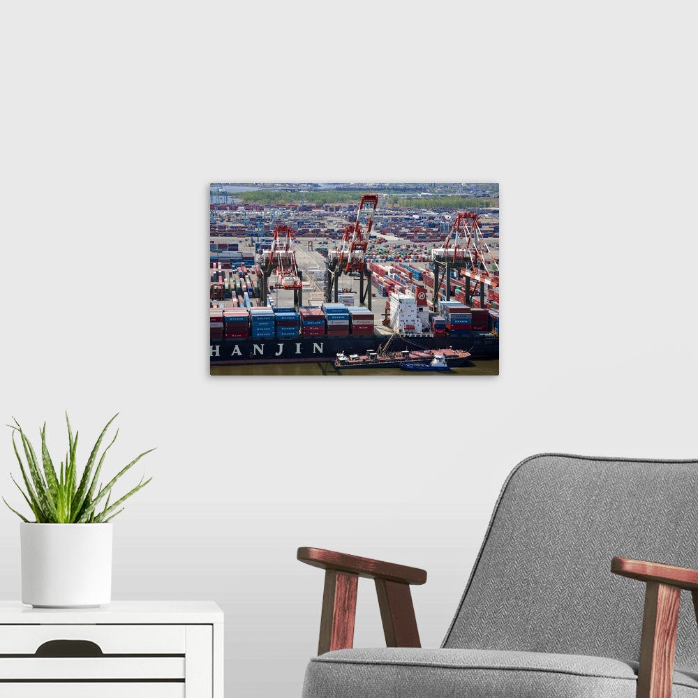 A modern room featuring Aerial view of container ship docked at Bayonne, New Jersey, USA.