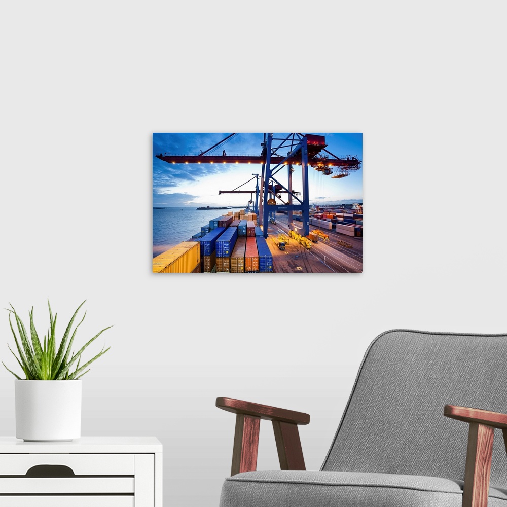 A modern room featuring Container terminal at dusk, view from cargo ship