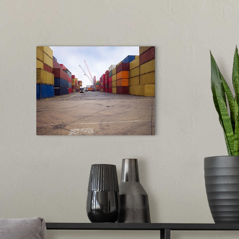 A modern room featuring Containers stacked in a shipping yard