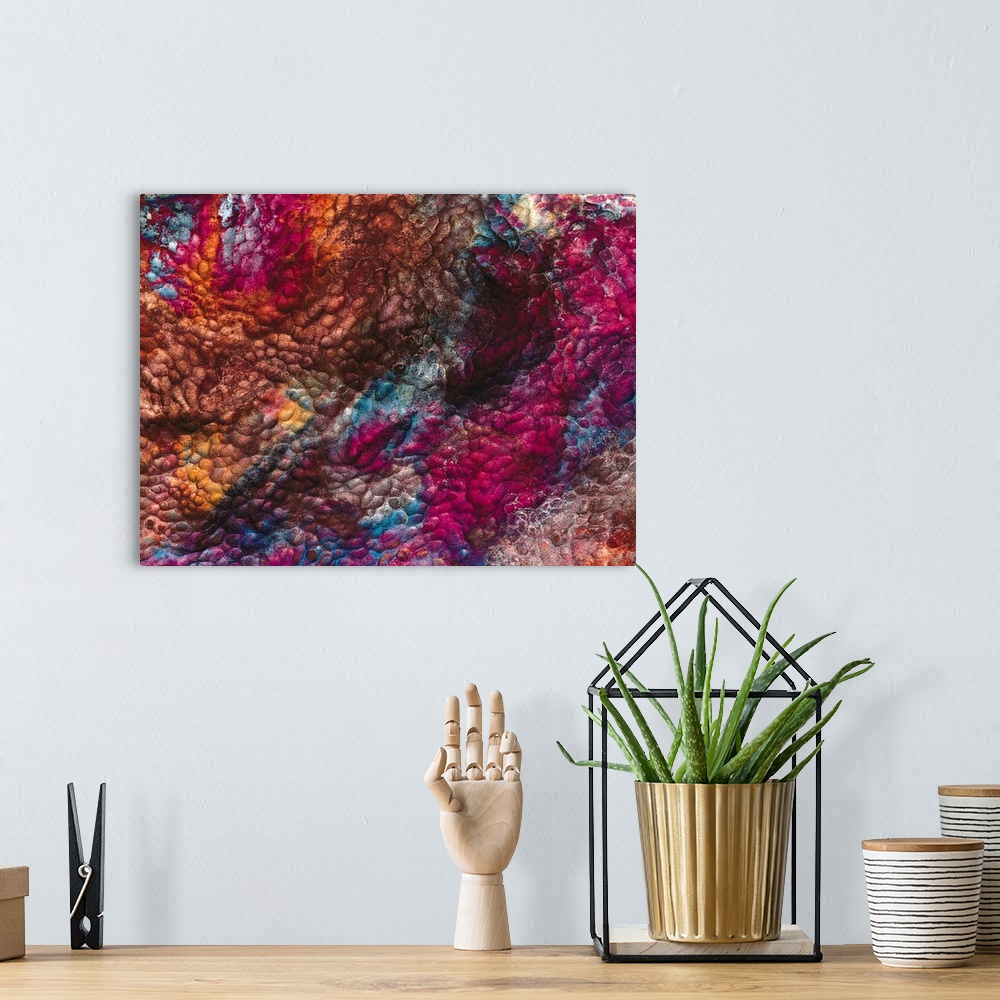 A bohemian room featuring Large, landscape, abstract wall hanging of a rough, bumpy texture in a variety of colors.