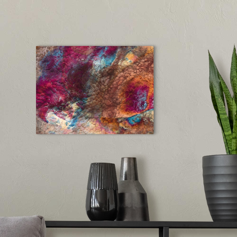 A modern room featuring Abstract artwork of a piece of metal that has various colors swirled around it.