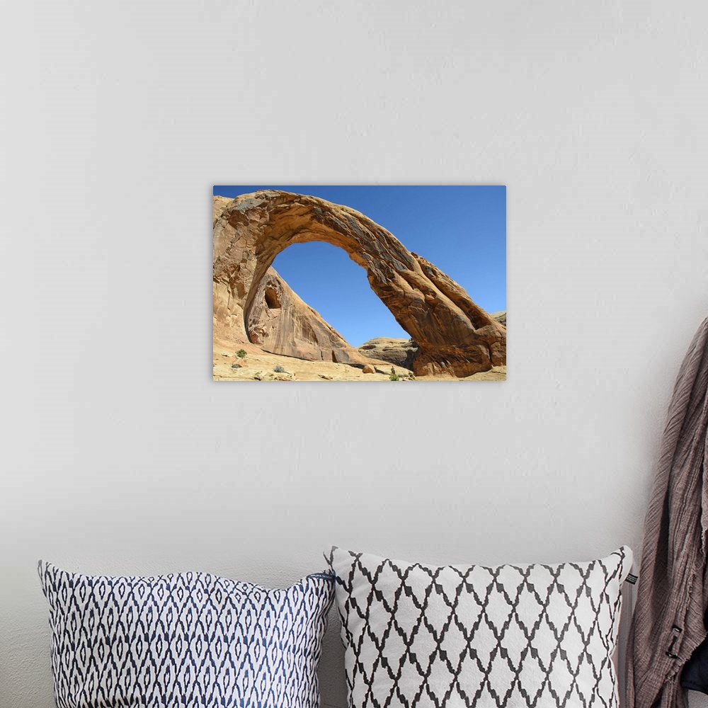 A bohemian room featuring Corona Arch against clear sky in Moab, Utah.
