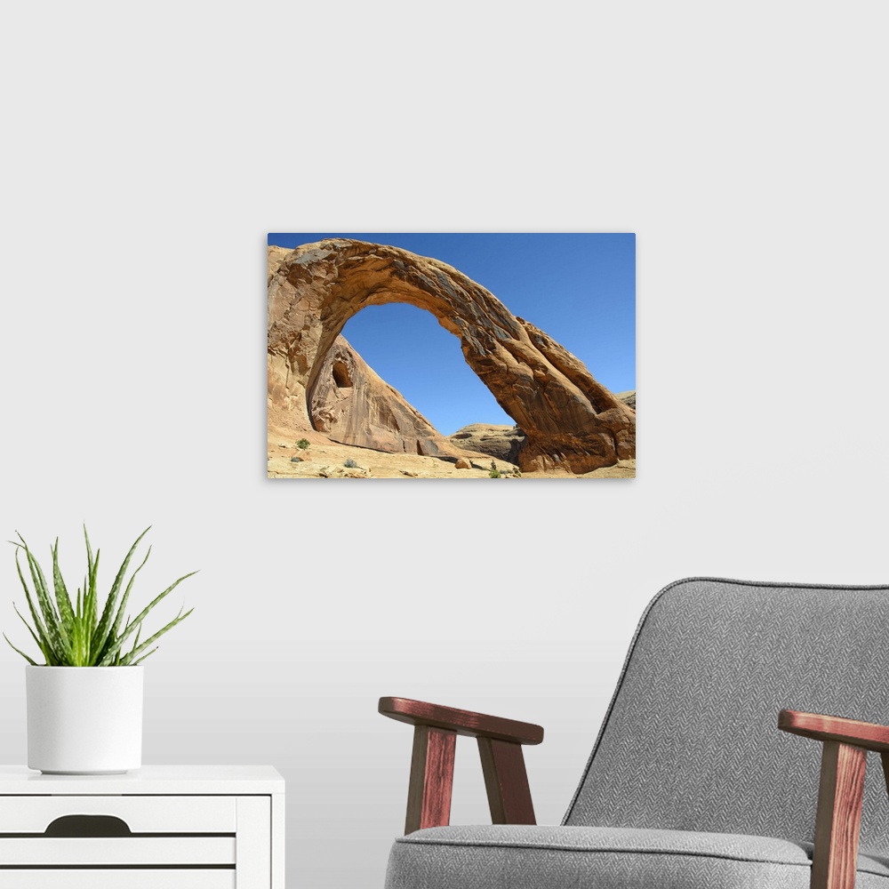 A modern room featuring Corona Arch against clear sky in Moab, Utah.