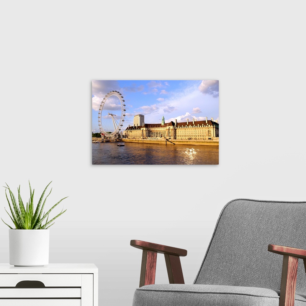 A modern room featuring County Hall with the London Eye and River Thames