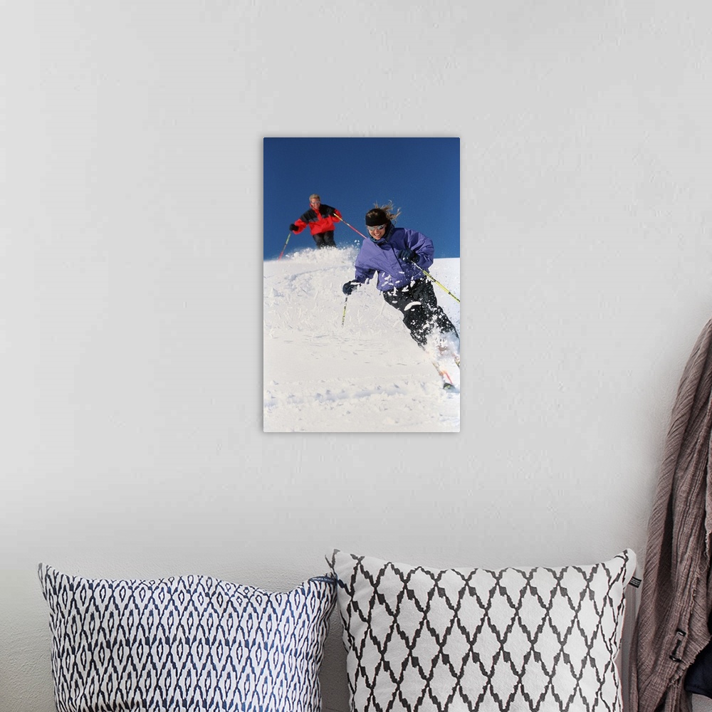 A bohemian room featuring Couple downhill skiing