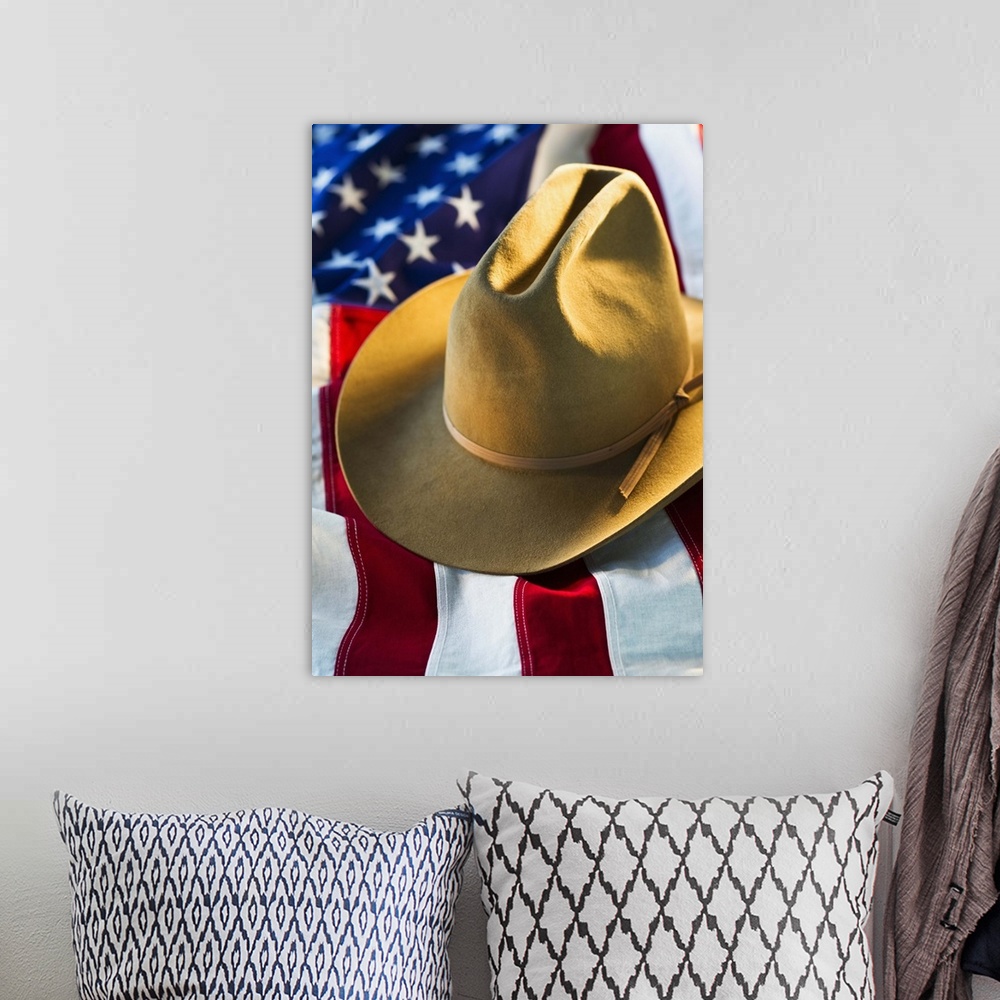 A bohemian room featuring Cowboy hat on American flag