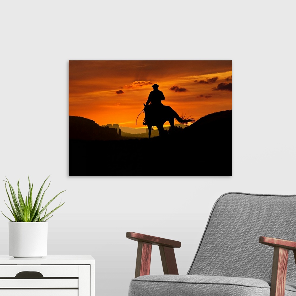 A modern room featuring Cowboy is riding through a valley in the night. Composition of two images.