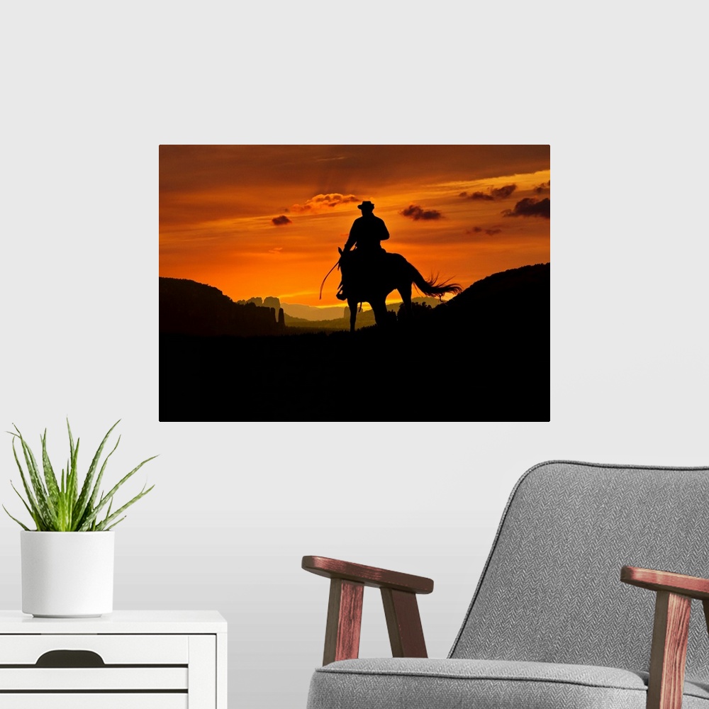 A modern room featuring Cowboy is riding through a valley in the night. Composition of two images.