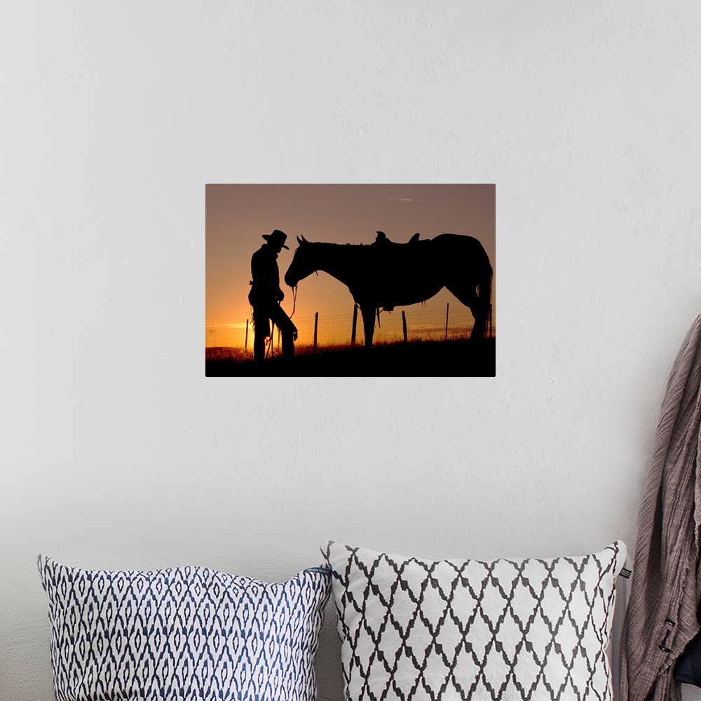 A bohemian room featuring Cowboy Standing With His Horse