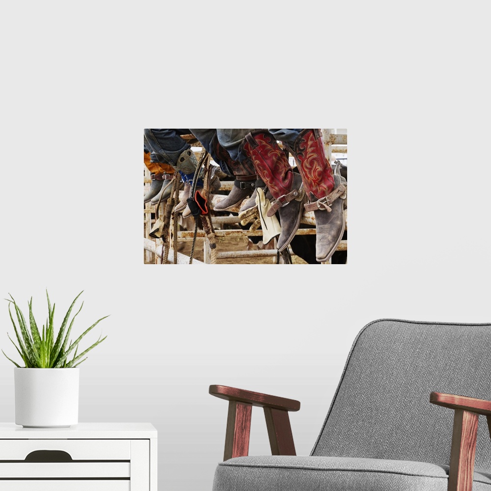 A modern room featuring Cowboys sitting on a cattle stall