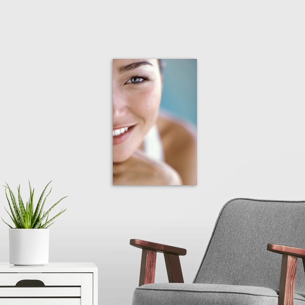 A modern room featuring Cropped portrait of woman's face