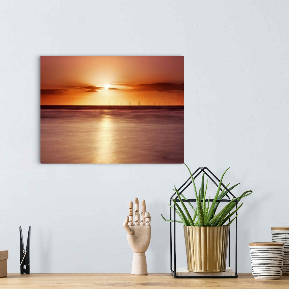 A bohemian room featuring Crosby beach,golden sunset with windfarm turbines and long exposure sea.