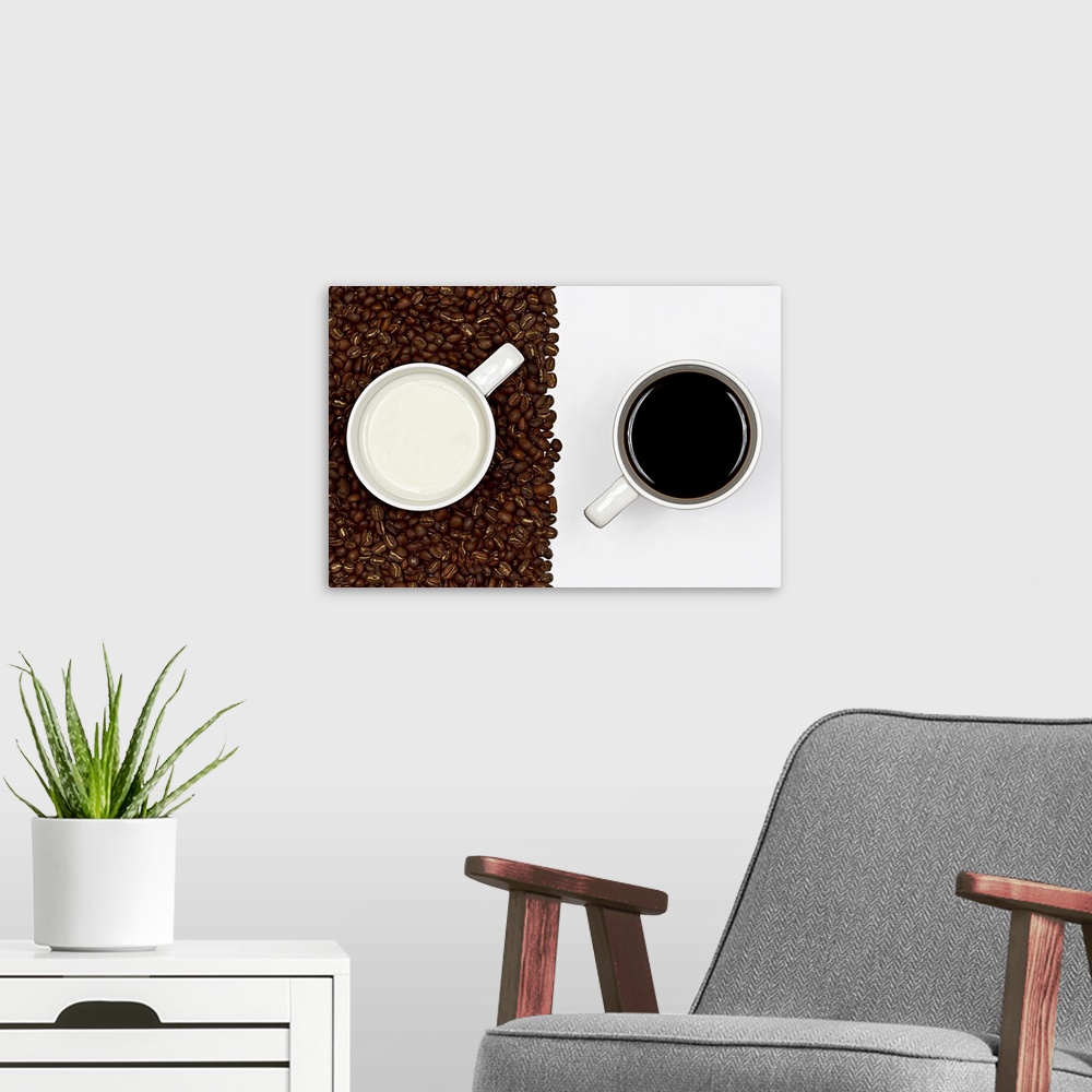 A modern room featuring Cup of black coffee on white background and  cup of white milk on  layer of coffee beans.
