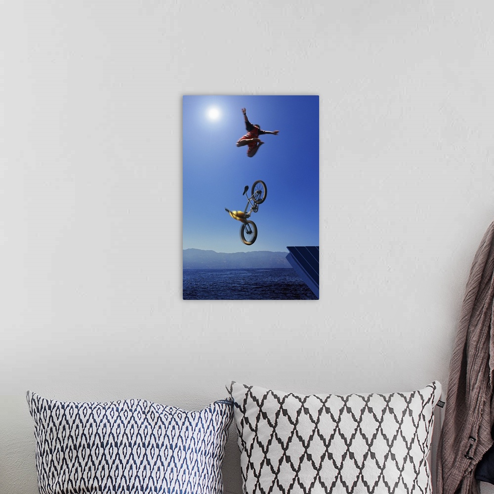 A bohemian room featuring Cyclist going off jump into water
