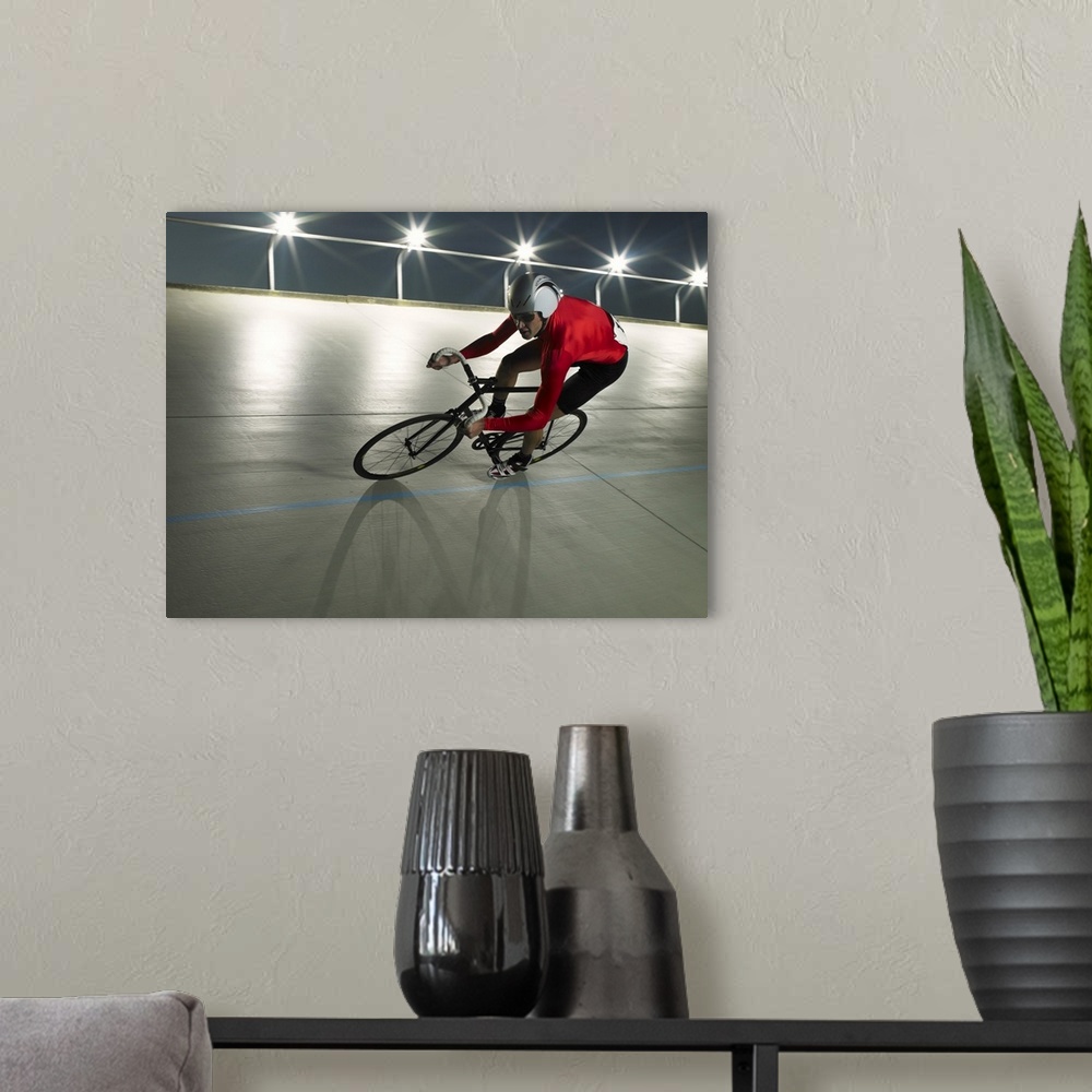 A modern room featuring Cyclist in action on velodrome track