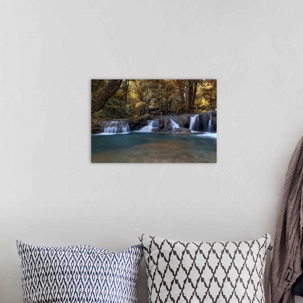 A bohemian room featuring Big, horizontal photograph of Daranak Falls along the edge of a dense forest in the Province of R...