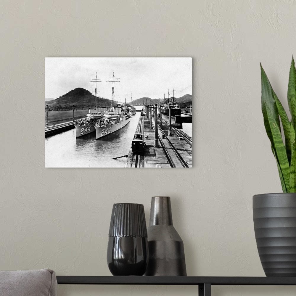 A modern room featuring A pair of US, World War I, destroyers on a journey along the Panama Canal.