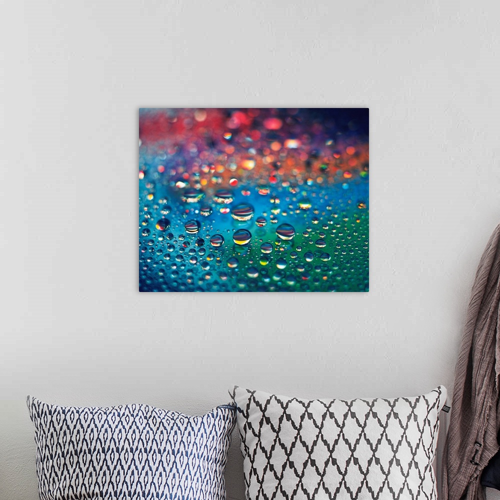 A bohemian room featuring Landscape, close up photograph of dew drops of various sizes on a rainbow colored surface, using ...