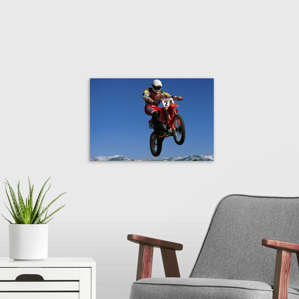 A modern room featuring Dirt biker in mid-air