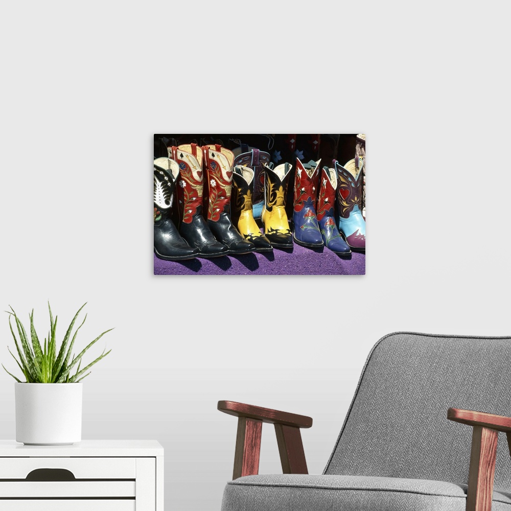 A modern room featuring Display Of Colorful Cowboy Boots