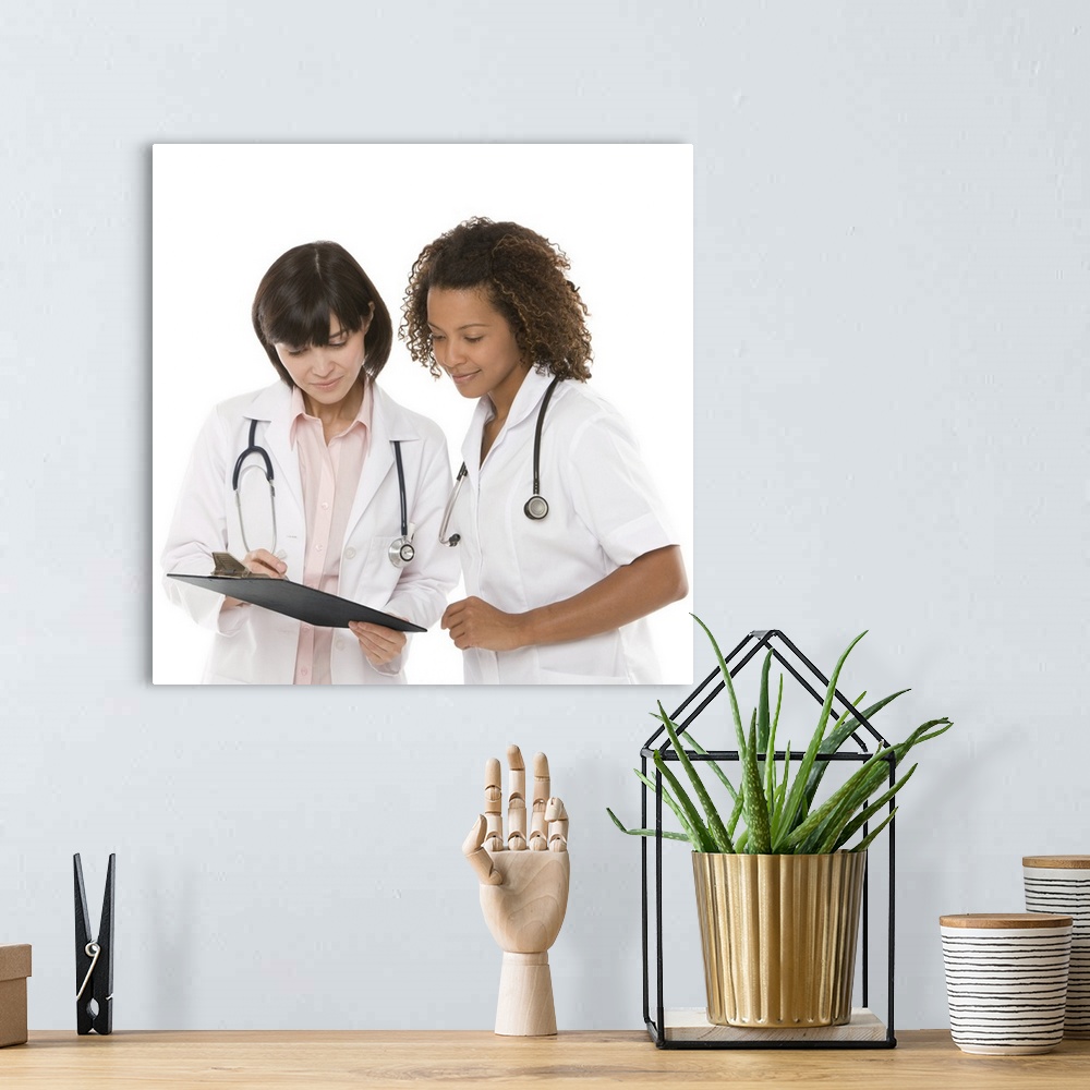 A bohemian room featuring Doctors looking at clipboard