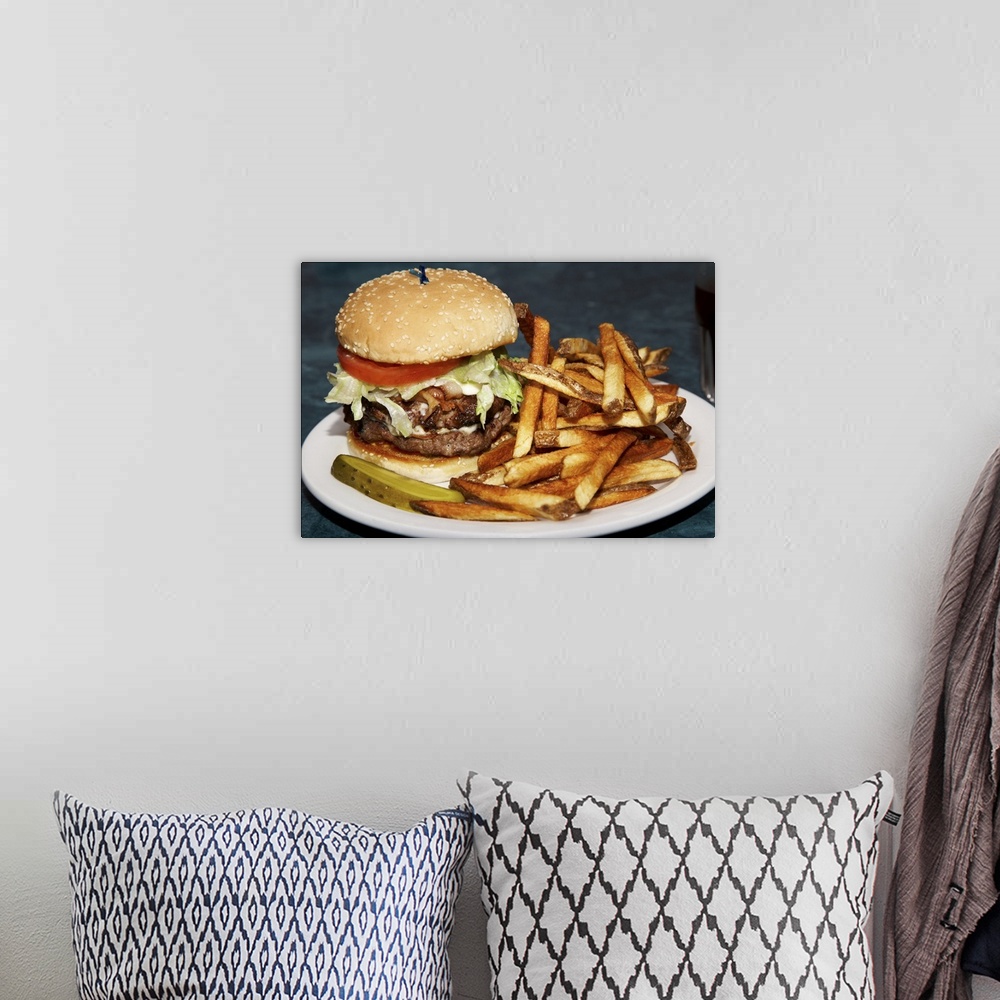 A bohemian room featuring large double half pound burger fries and cola meal