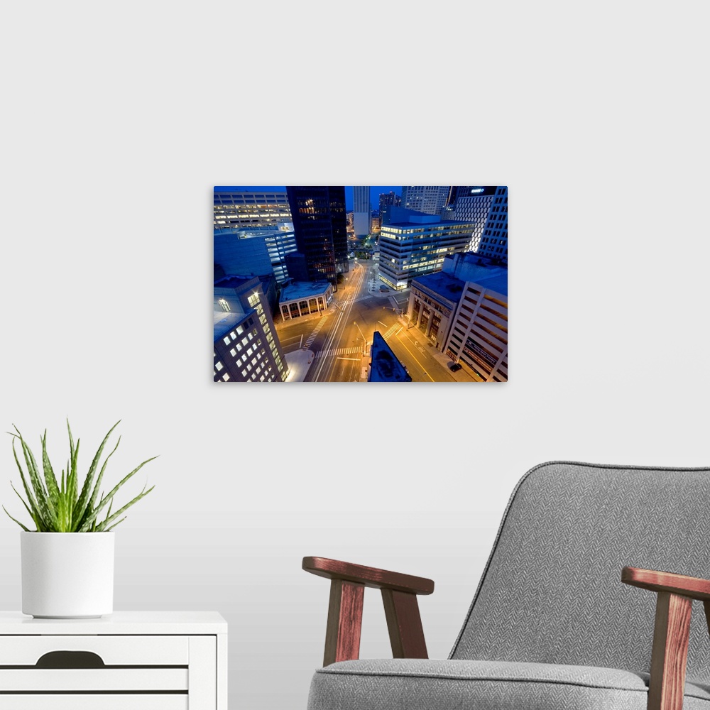A modern room featuring The intersection of Michigan Avenue, Griswold, and Lafayette in downtown Detroit, Michigan.