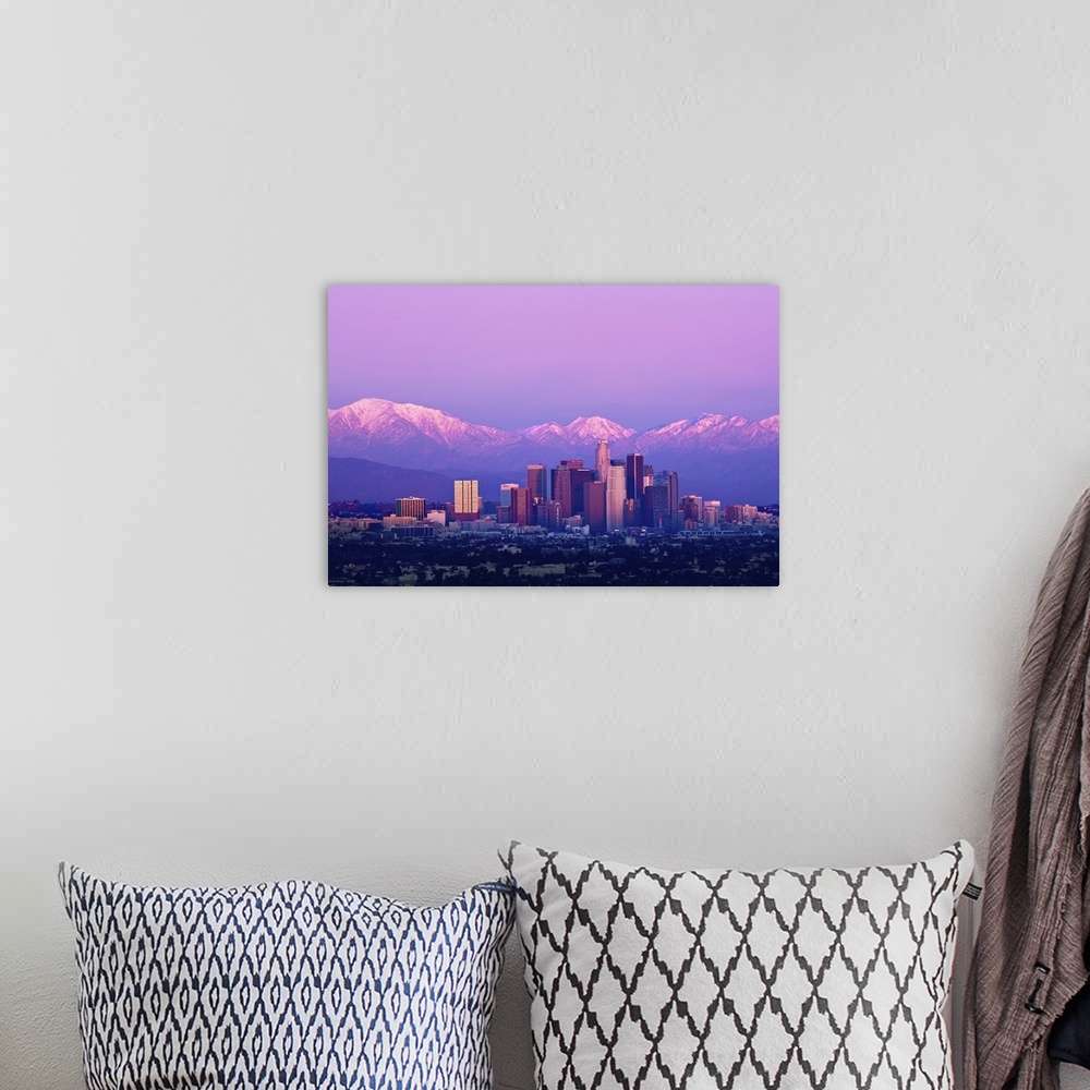 A bohemian room featuring Downtown Los Angeles and sunset. Buildings are lit from setting sun and mountains are capped with...