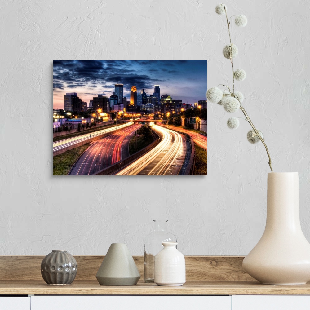 A farmhouse room featuring Giant photograph depicts a busy city filled with skyscrapers and highways brightly lit at night. ...