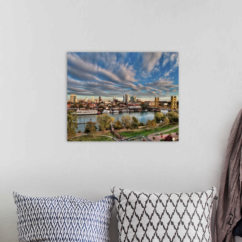 A bohemian room featuring Clouds over cityscape of  Downtown Sacramento at sunset.