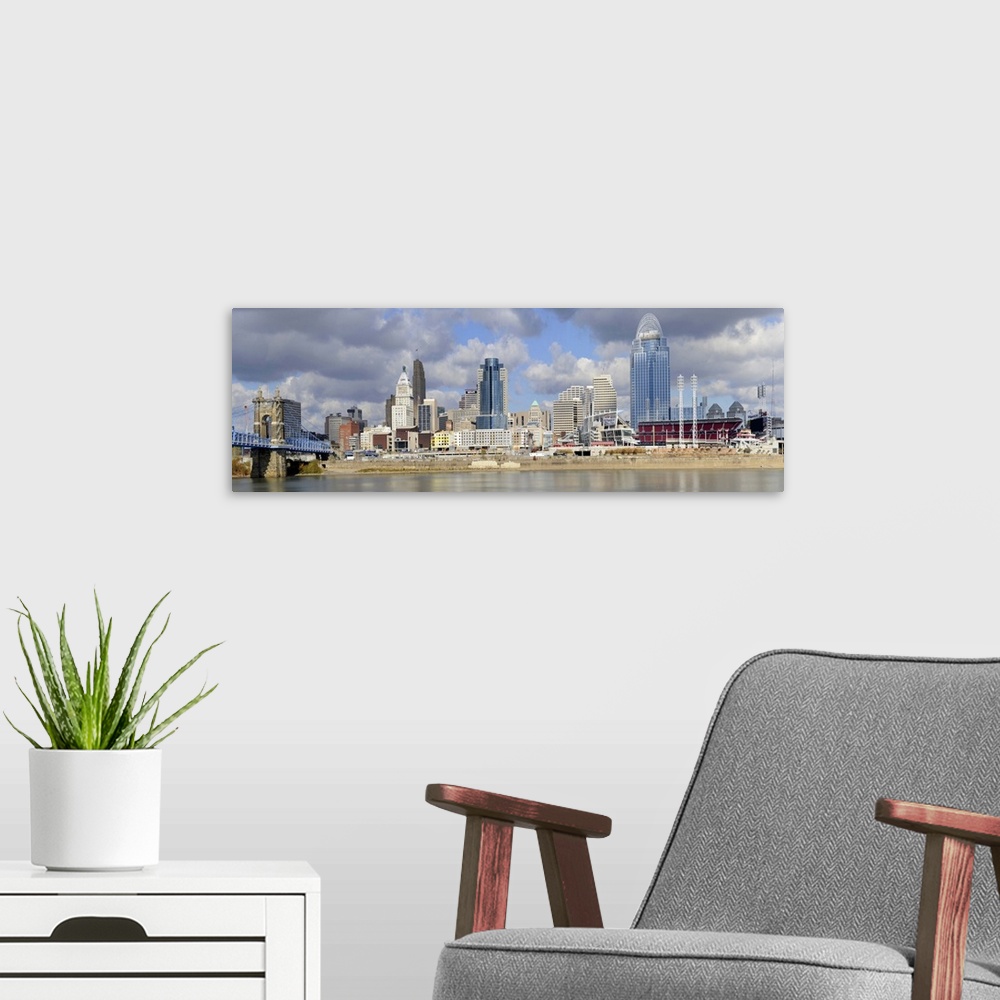 A modern room featuring Downtown skyline of Cincinnati as view across the Ohio River.