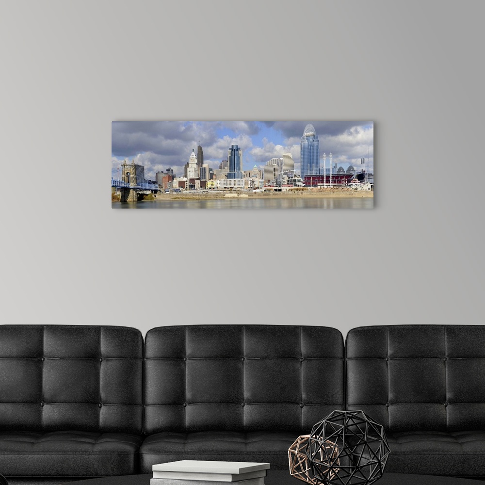 A modern room featuring Downtown skyline of Cincinnati as view across the Ohio River.