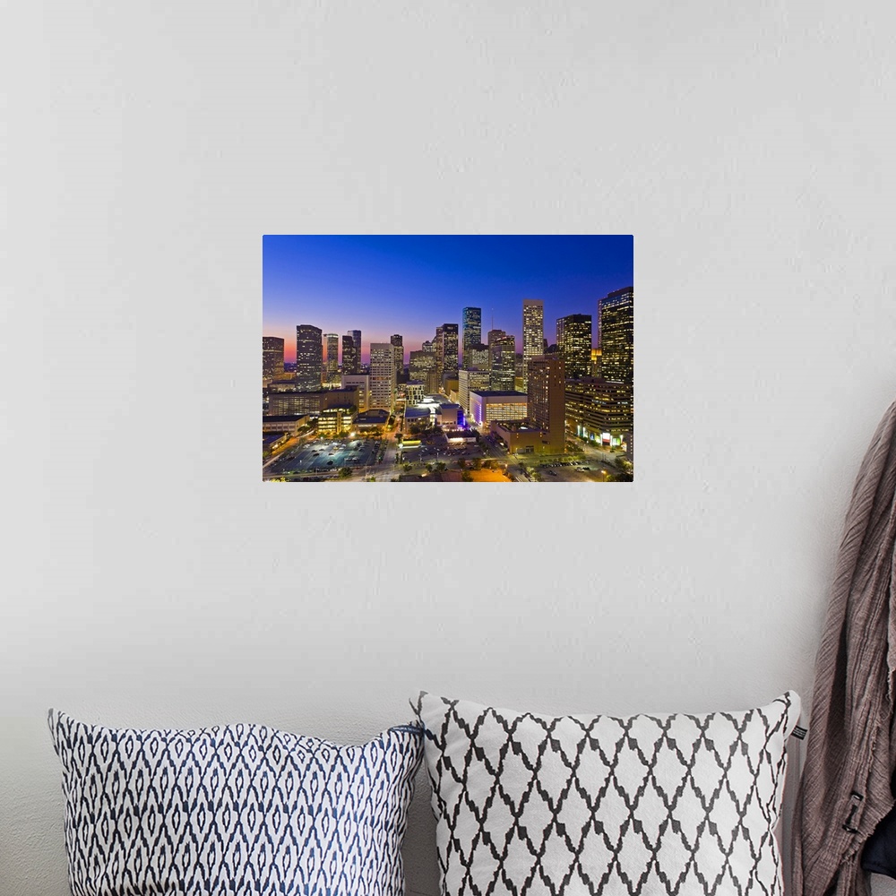 A bohemian room featuring Downtown city skyline at dusk/sunset/night, Houston, Texas, USA. Houston is the fourth largest ci...