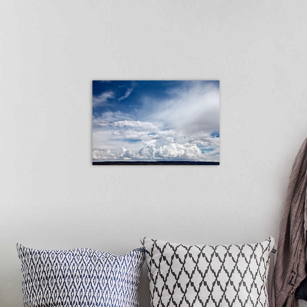 A bohemian room featuring Dramatic clouds in sky over mesa in Abo, NM