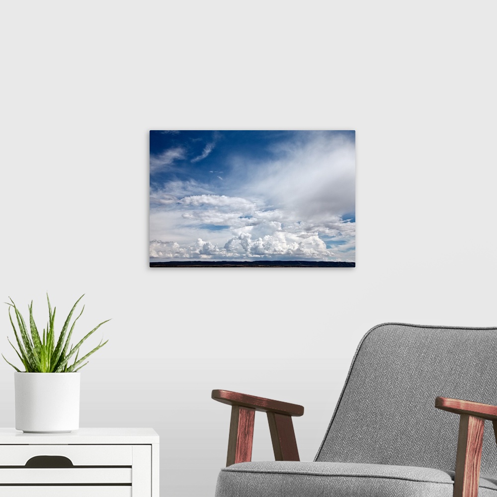 A modern room featuring Dramatic clouds in sky over mesa in Abo, NM